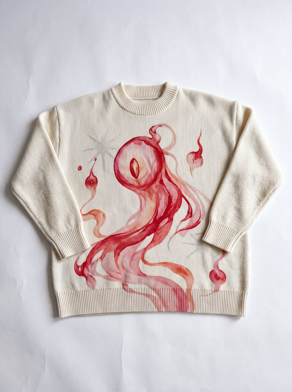 Front of the cream Hitodama knit on a light studio background
