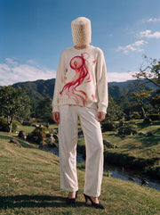 Model wearing Hitodama Knit (Akane), full front view outdoors